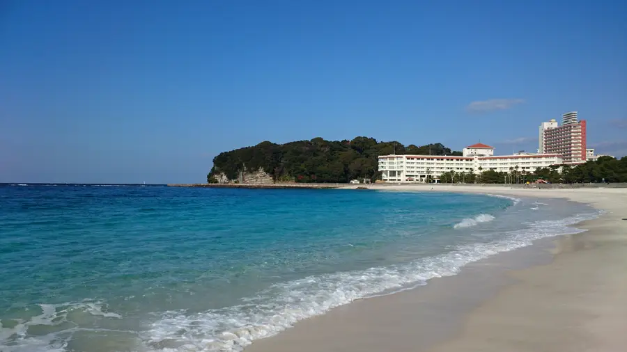 The white-sand curve of Shirarahama Beach and its turquoise water in Shirahama, Wakayama